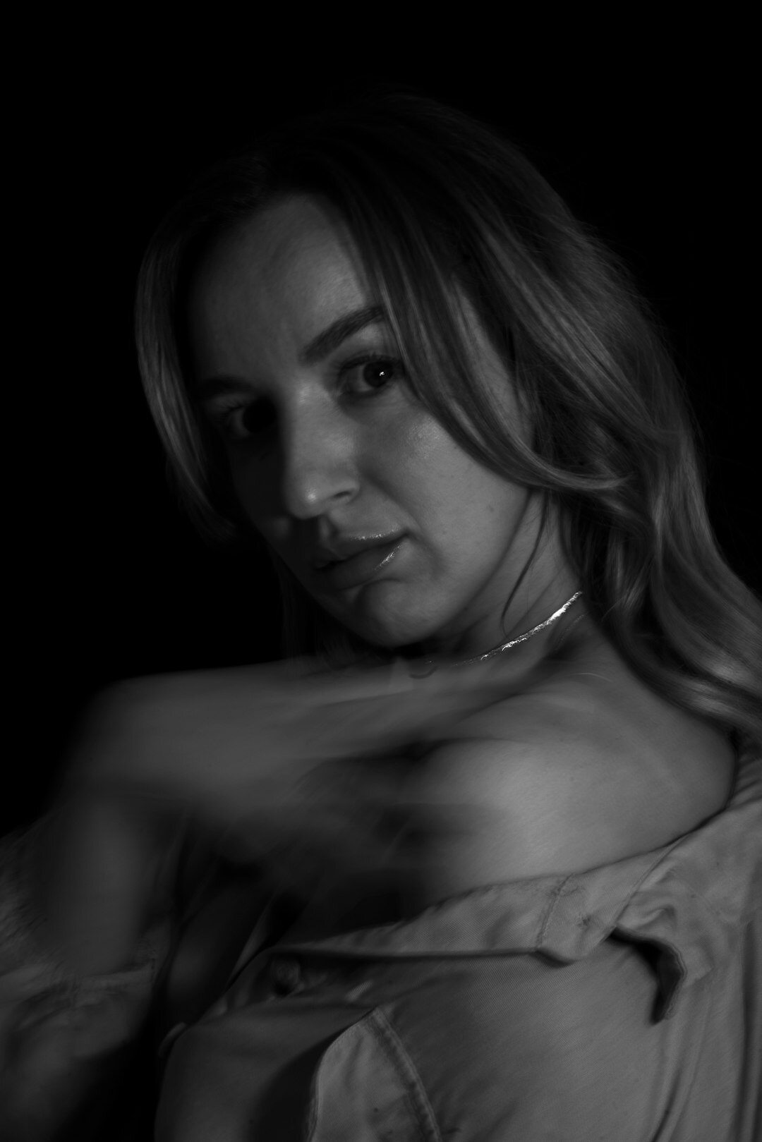Studio portrait of a woman in her forties, elegant editor, looking confidently at the camera