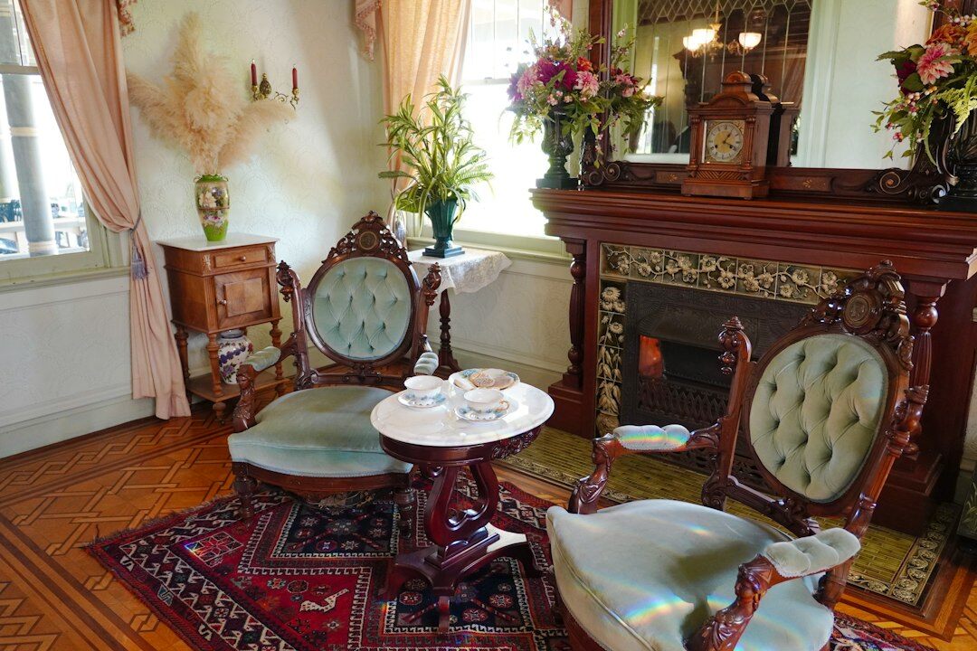 Opulent vintage salon with velvet armchairs and a marble fireplace